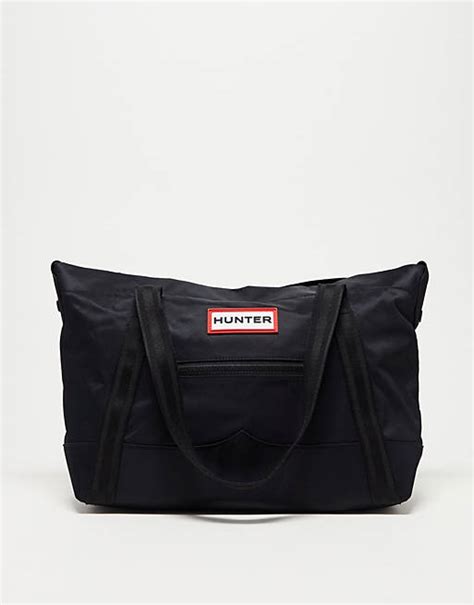 Hunter nylon clip top tote midi bag in black .